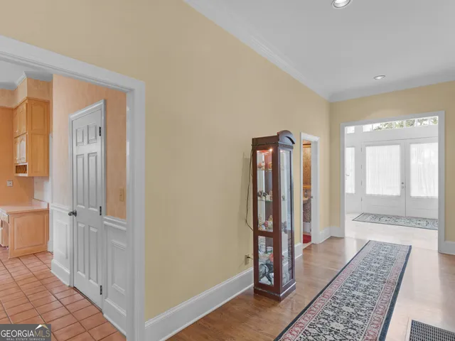 a spacious bathroom with a double vanity sink and a mirror