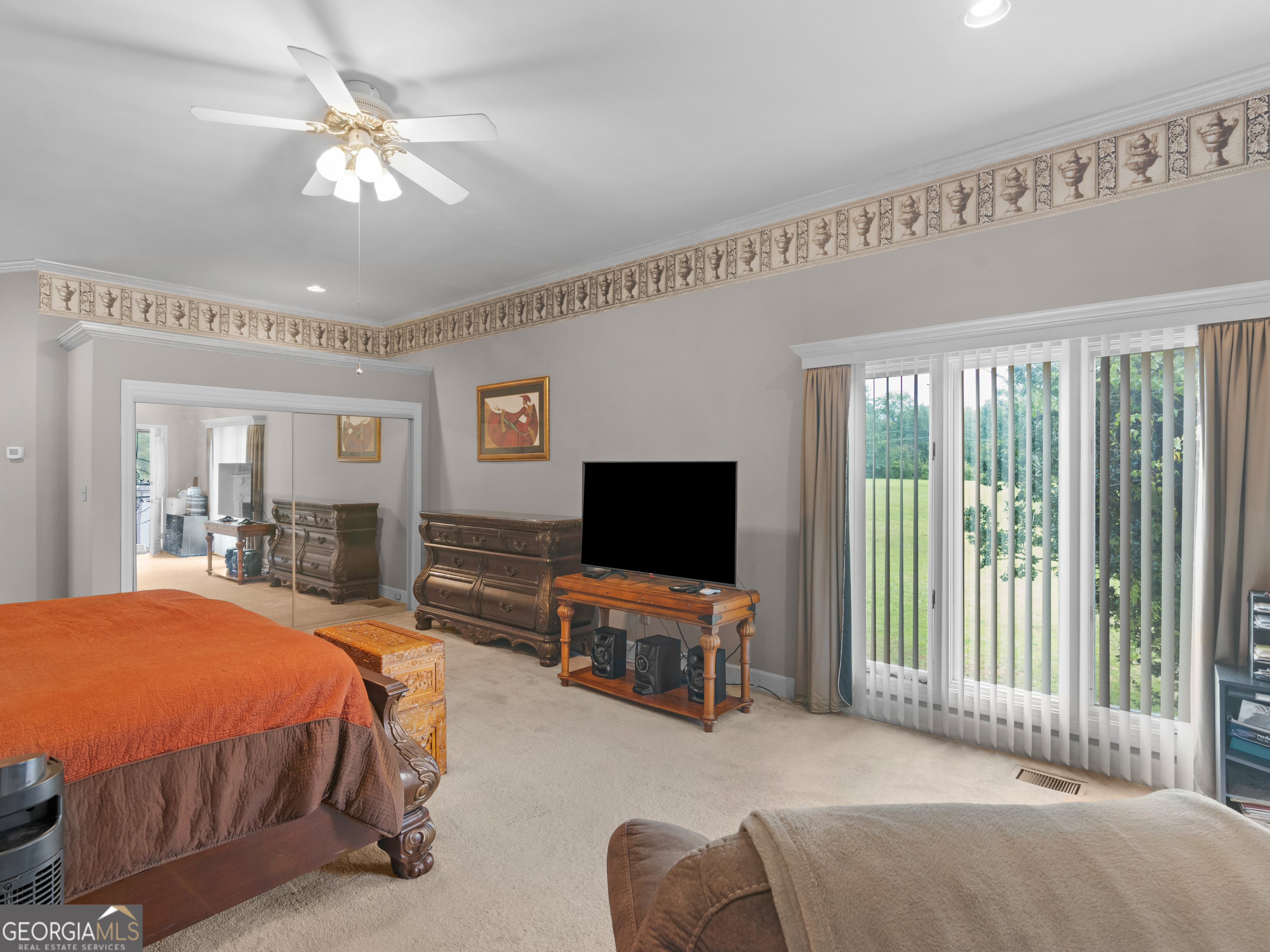 474 North Rover Road Williamson, GA 30292 - Photo 26 of 89 a bedroom with a bed and glass door