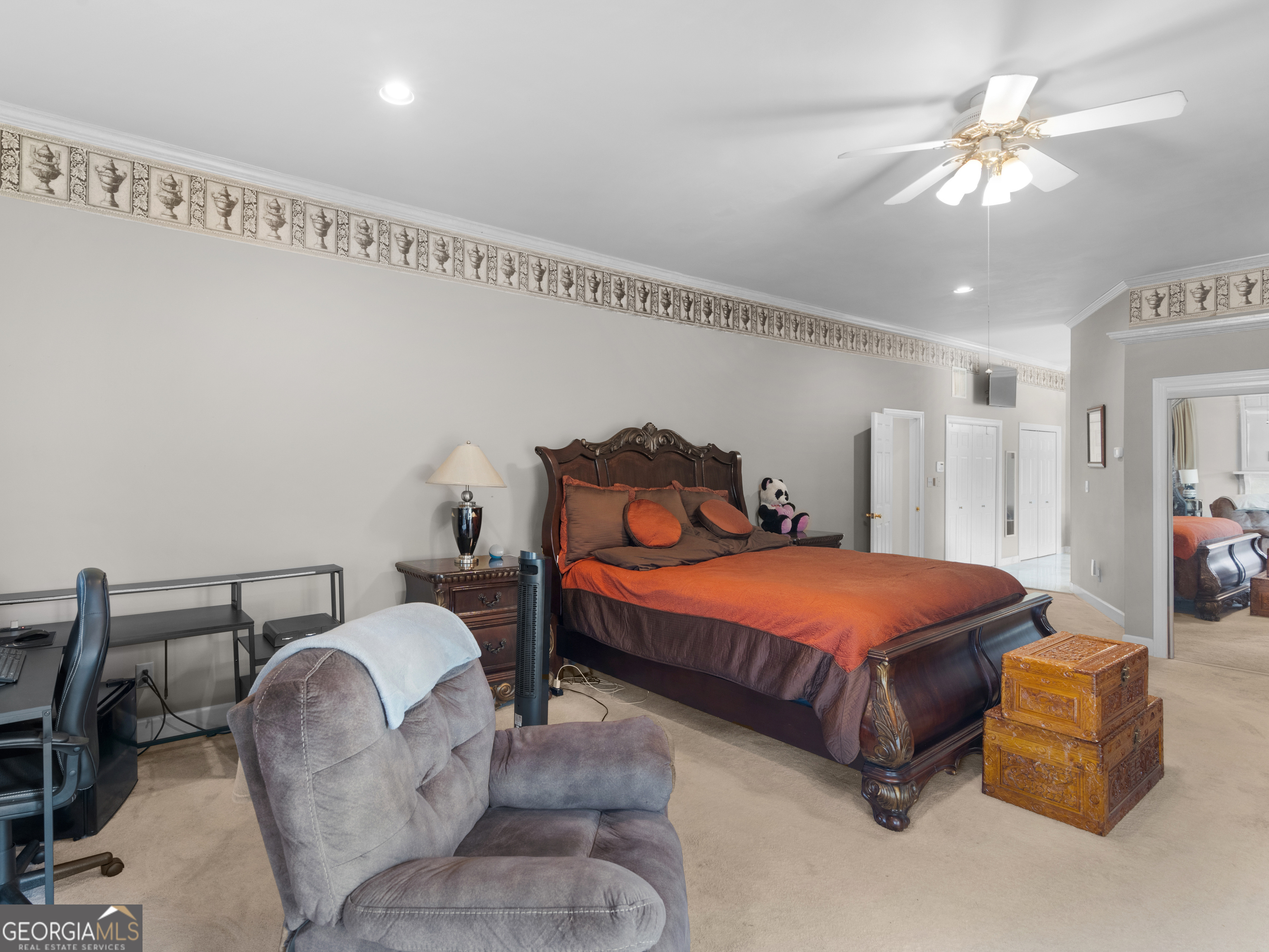 474 North Rover Road Williamson, GA 30292 - Photo 27 of 89 a bedroom with a bed and a chandelier