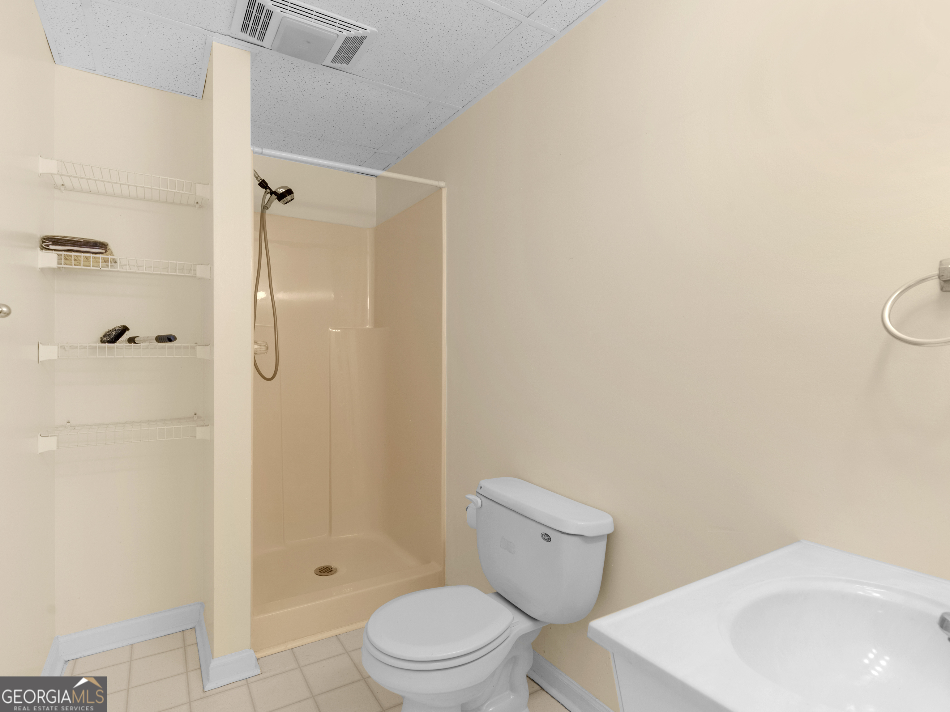 474 North Rover Road Williamson, GA 30292 - Photo 70 of 89 a white toilet sitting next to a bathroom sink