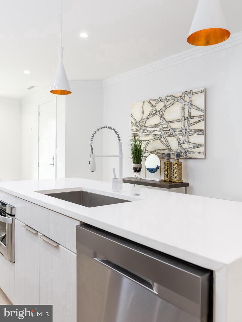 3527 14th Street Northwest, Unit 3 Washington, DC 20010 - Photo 4 of 12 a kitchen with a sink and a stove