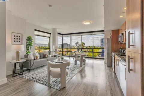 a living room with fireplace furniture and a wooden floor
