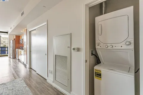 a view of a hallway with washer and dryer