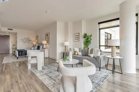 a living room with fireplace furniture and a table