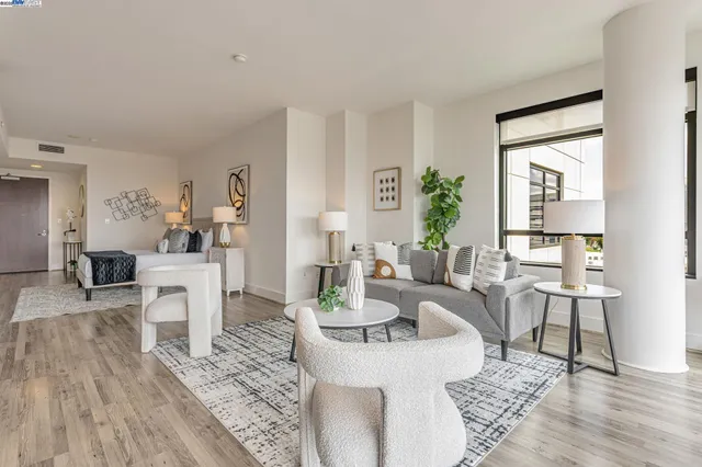 a living room with fireplace furniture and a table