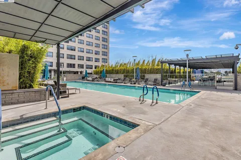 a park view with a bench and tables