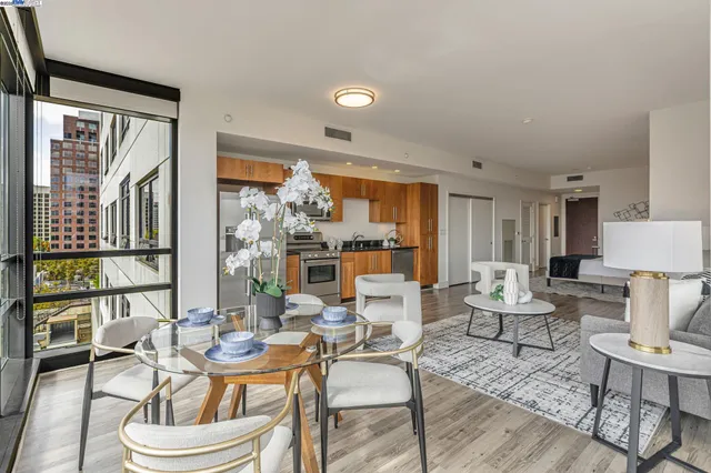 a living room with furniture and a floor to ceiling window