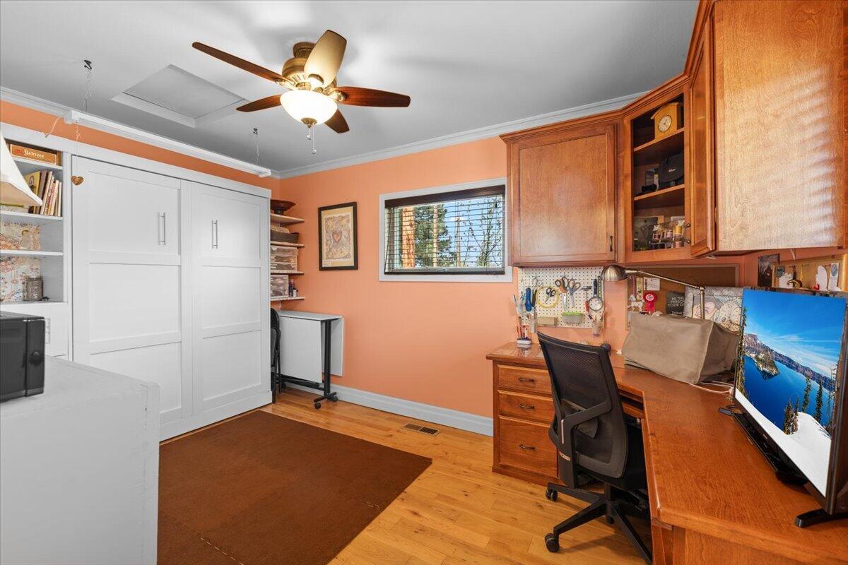 440 Bush Street Central Point, OR 97502 - Photo 6 of 40 a view of a workspace with furniture and a window