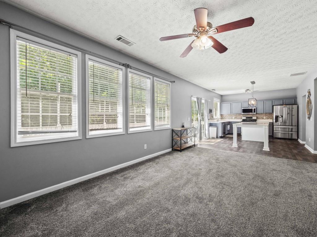 95 Ridge Water Lane Dawsonville, GA 30534 - Photo 15 of 45 a view of a livingroom with furniture window and outside view