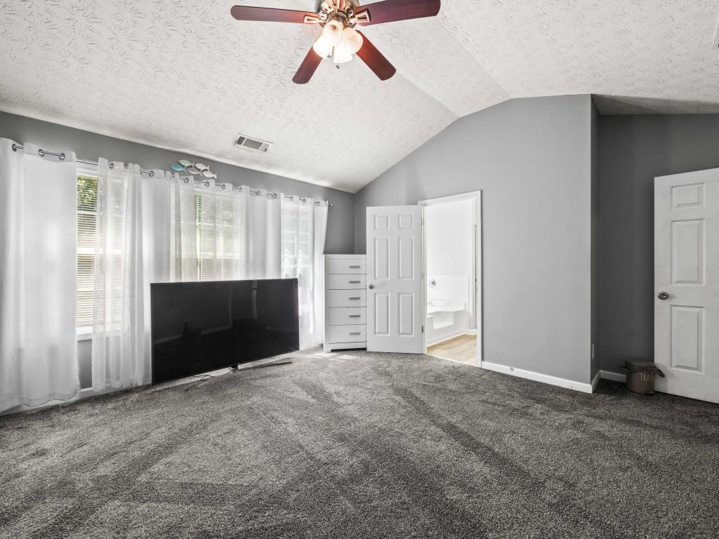 95 Ridge Water Lane Dawsonville, GA 30534 - Photo 18 of 45 a view of an empty room with a fireplace and a window