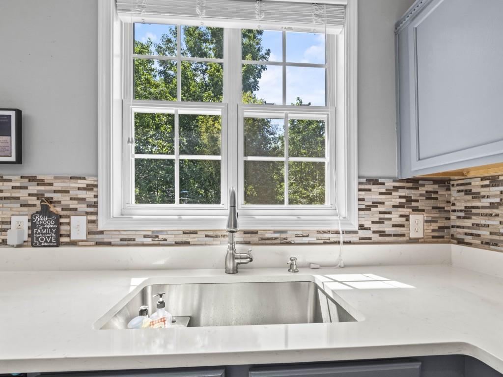 95 Ridge Water Lane Dawsonville, GA 30534 - Photo 32 of 45 a kitchen with a sink and a window