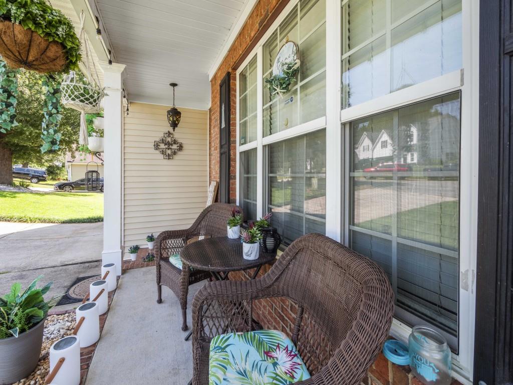 95 Ridge Water Lane Dawsonville, GA 30534 - Photo 5 of 45 a view of a porch with furniture and garden