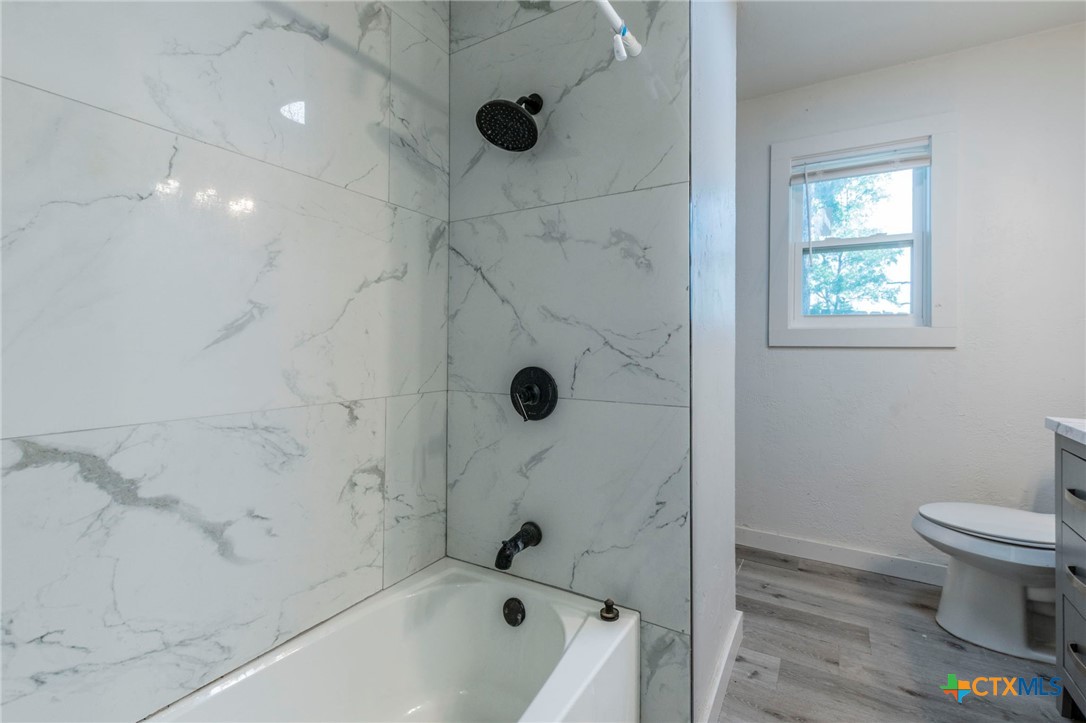 4013 Valley View Drive Temple, TX 76502 - Photo 18 of 25 a bathroom with a sink a toilet and shower