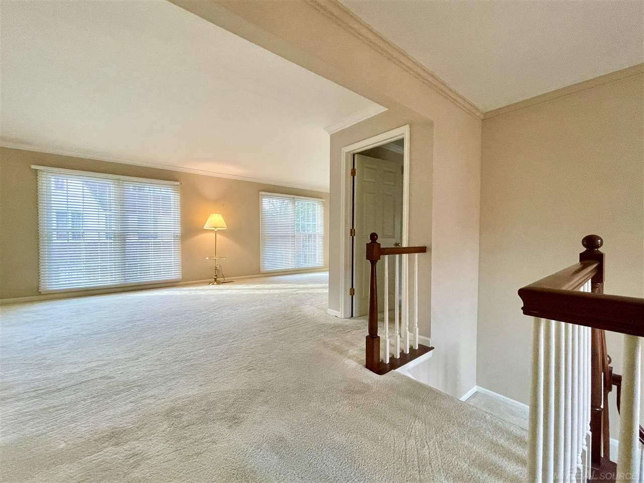 744 Trombley Road Grosse Pointe, MI 48230 - Photo 6 of 32 Open layout, all-new near floor to ceiling Pella windows and blinds throughout.