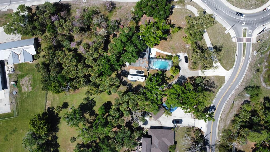 6440 Richardson Road Sarasota, FL 34240 - Photo 15 of 15 an aerial view of a house with a yard and garden