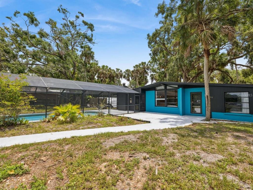 6440 Richardson Road Sarasota, FL 34240 - Photo 2 of 15 a view of a house with a yard and large tree