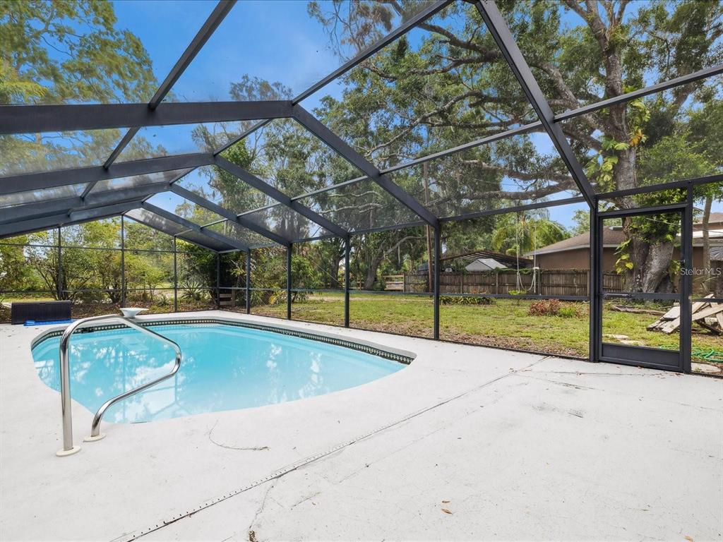 6440 Richardson Road Sarasota, FL 34240 - Photo 3 of 15 a view of a backyard with swimming pool