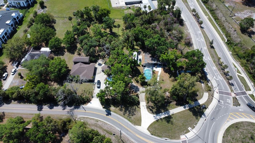 6440 Richardson Road Sarasota, FL 34240 - Photo 9 of 15 an aerial view of residential house with outdoor space and trees all around