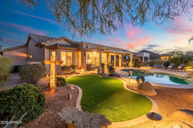 a view of a swimming pool with a patio