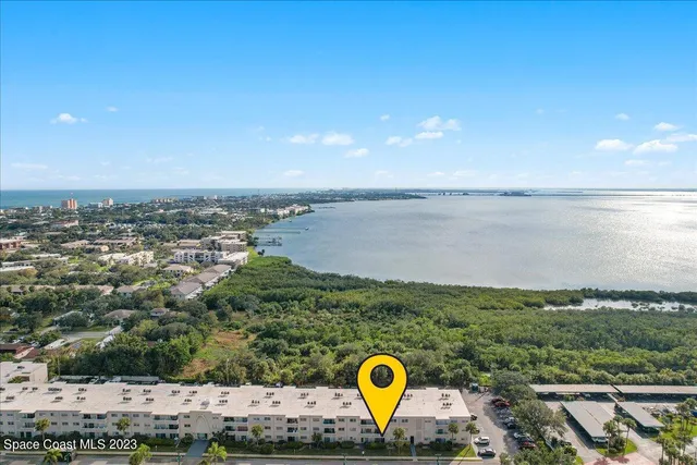 a kitchen with granite countertop white cabinets sink and stainless steel appliances