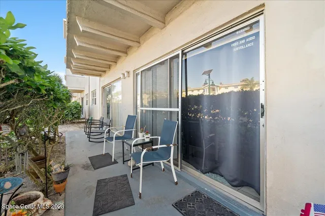 a bedroom with a bed a dresser and a window