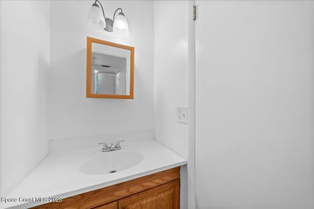 an aerial view of a house with a swimming pool patio and outdoor seating