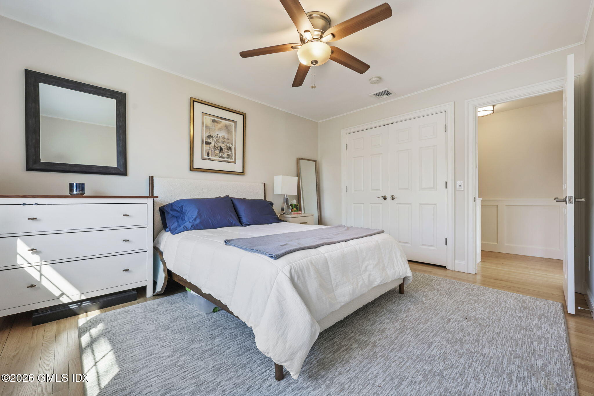 97 Davenport Ridge Lane Stamford, CT 06903 - Photo 18 of 31 a bedroom with a bed and a dresser