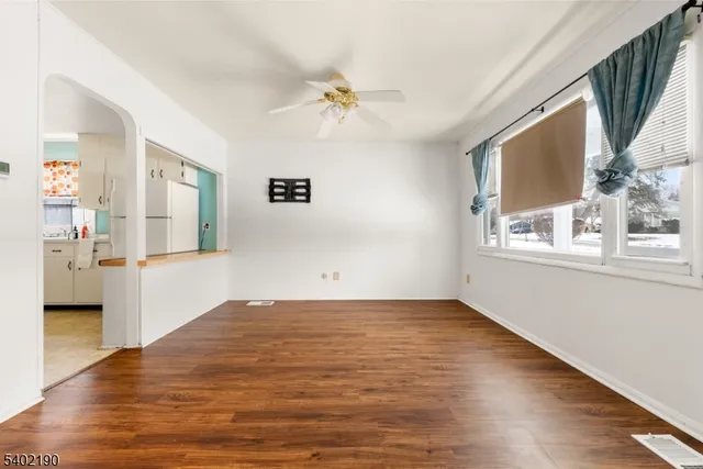 a view of a living room with a large window