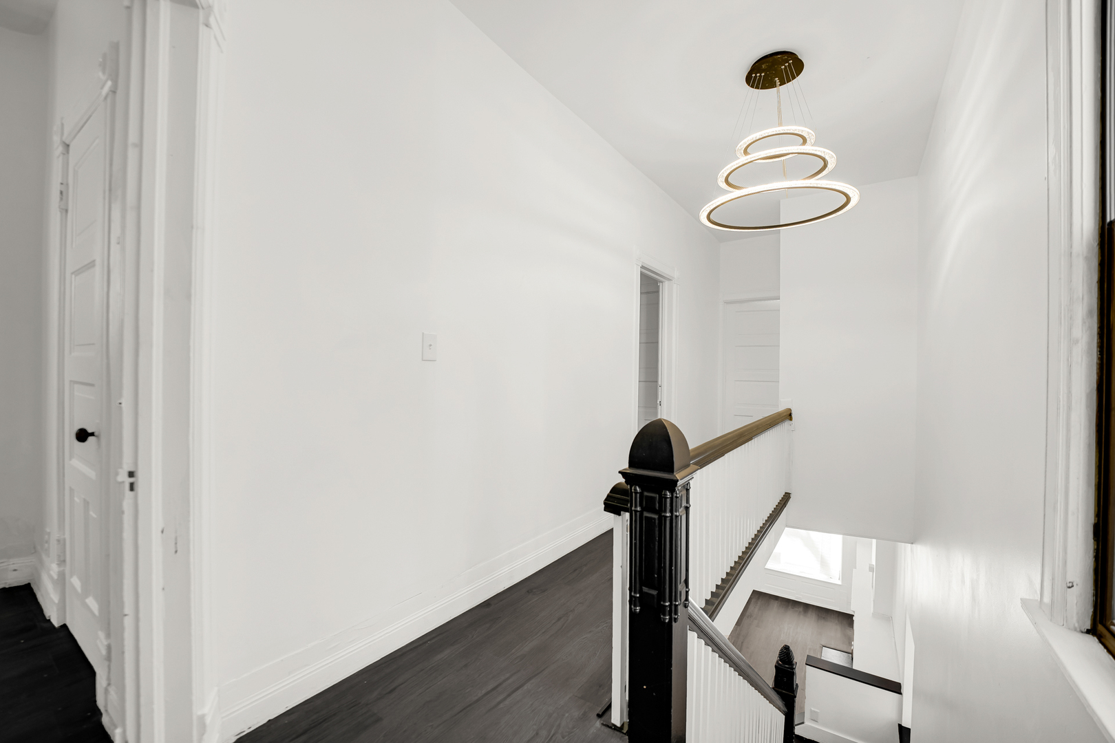 928 East 46th Street Chicago, IL 60653 - Photo 11 of 25 a view of a hallway with wooden floor