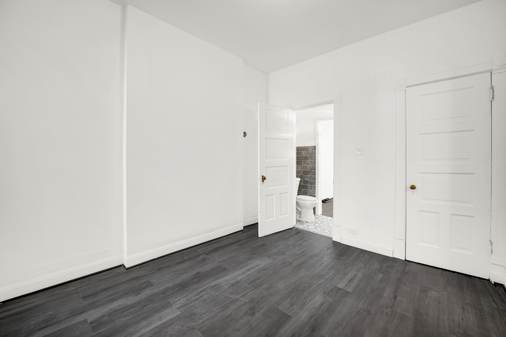 928 East 46th Street Chicago, IL 60653 - Photo 17 of 25 a view of empty room with wooden floor