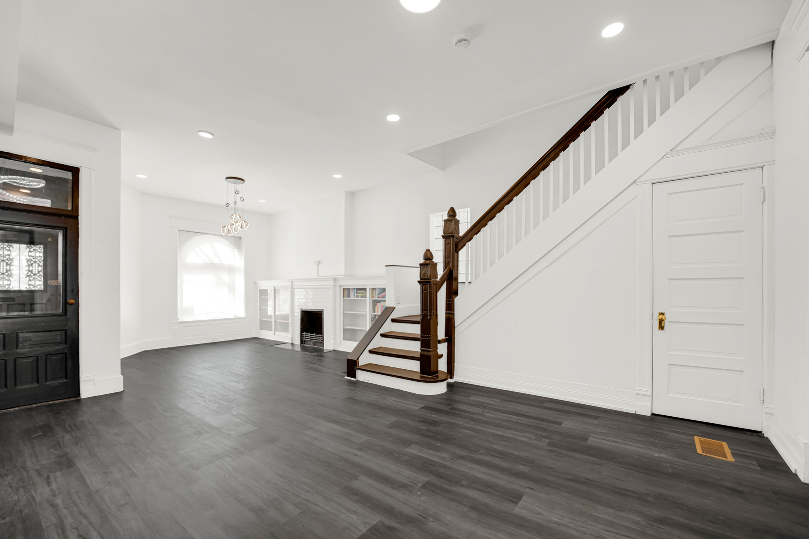 928 East 46th Street Chicago, IL 60653 - Photo 5 of 25 a view of entryway with wooden floor and stairs