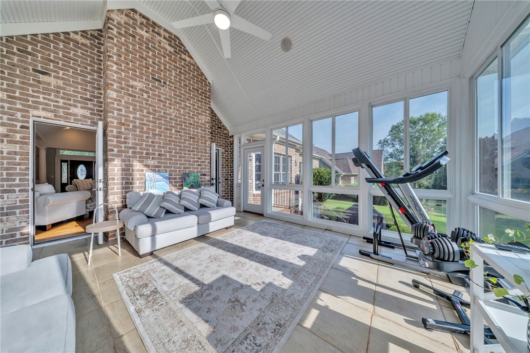 102 Country Walk Lane Clemson, SC 29631 - Photo 20 of 39 Sun-filled leisure room with a vaulted ceiling and direct outdoor access, perfect for relaxation or fitness activities.