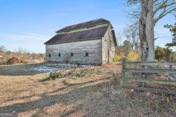 a view of house with wooden fence