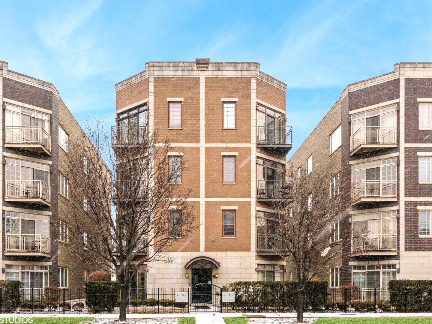 7932 West Grand Avenue, Unit 2W Elmwood Park, IL 60707 - Photo 1 of 22 a front view of a multi story building