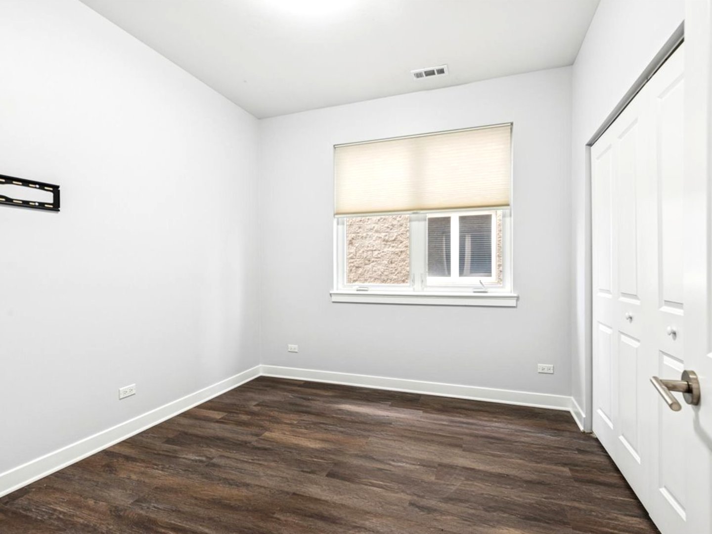 7932 West Grand Avenue, Unit 2W Elmwood Park, IL 60707 - Photo 16 of 22 an empty room with wooden floor and windows