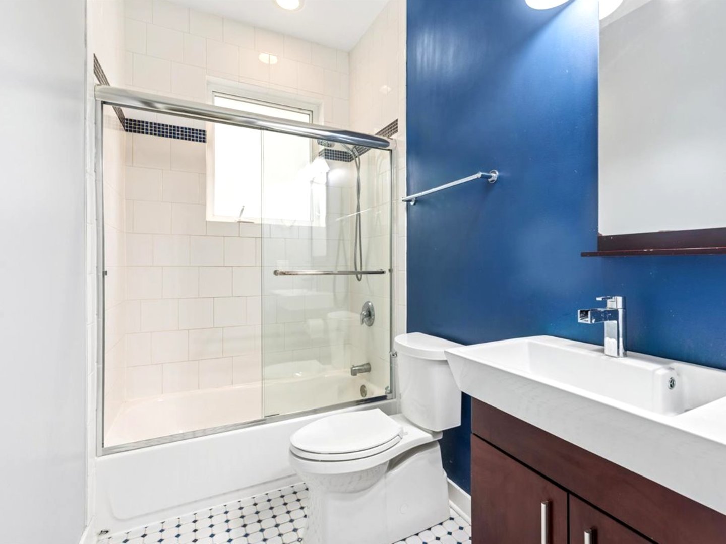 7932 West Grand Avenue, Unit 2W Elmwood Park, IL 60707 - Photo 17 of 22 a bathroom with a sink a toilet a mirror and shower