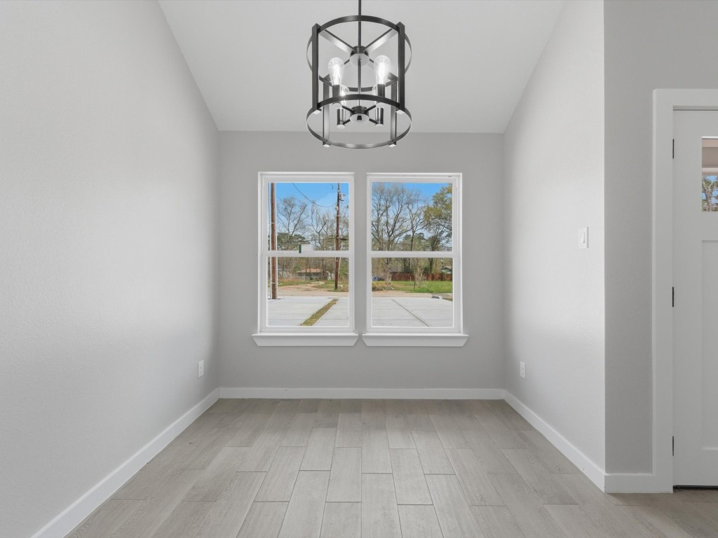 308 South 11th Street Conroe, TX 77301 - Photo 10 of 24 an empty room with a window