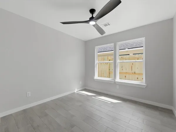a spacious bathroom with a double vanity sink and mirror