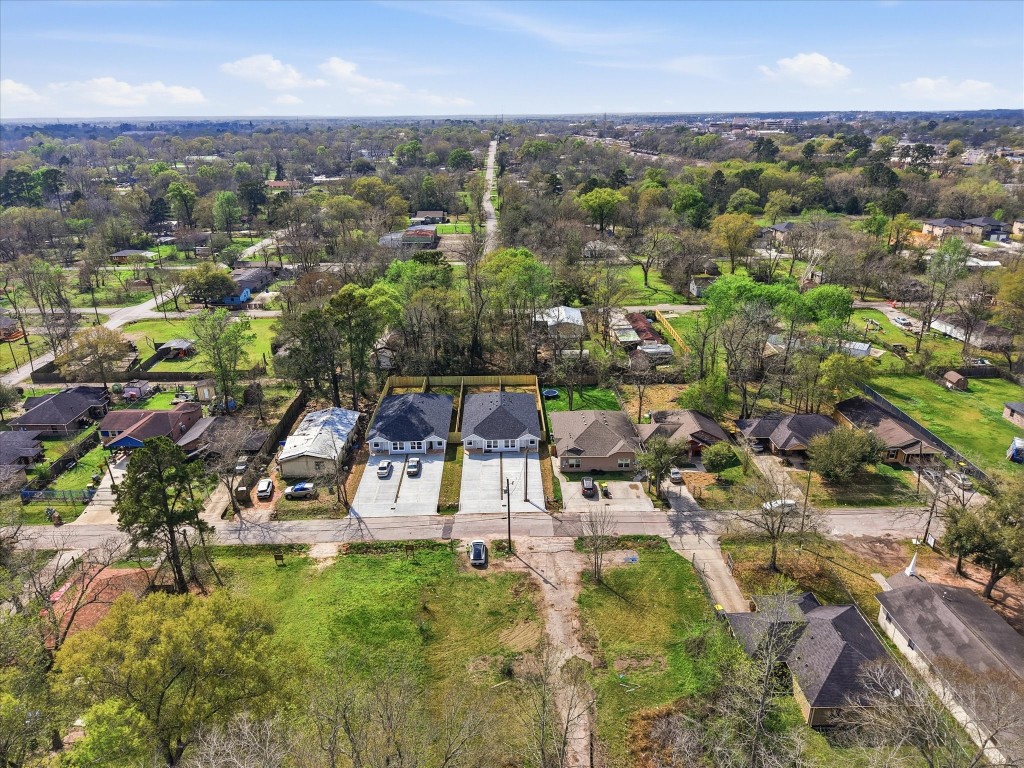 308 South 11th Street Conroe, TX 77301 - Photo 23 of 24 an aerial view of a residential houses with outdoor space and trees