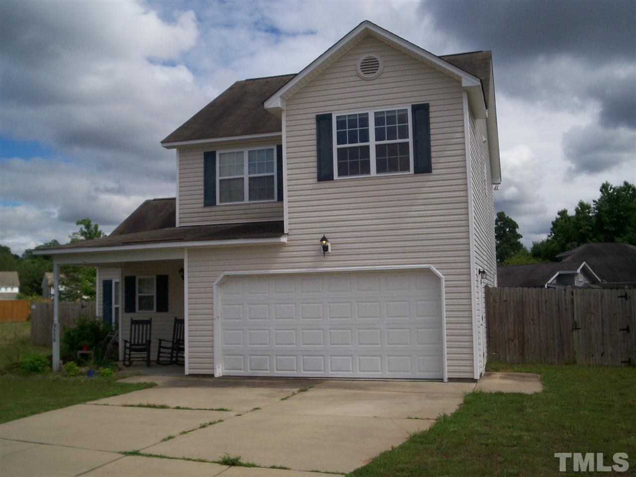5320 Chipstone Drive Raleigh, NC 27610 - Photo 3 of 3 a front view of a house with a yard