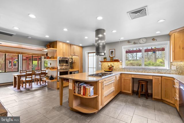 a spacious bedroom with a bed and couch