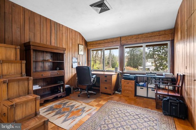a building outdoor space with patio furniture and potted plants