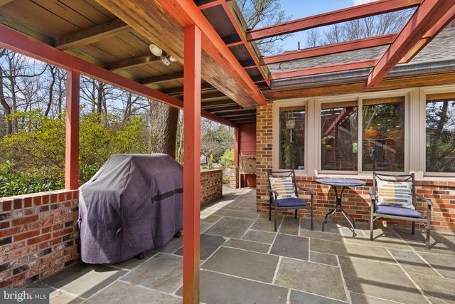 a view of a building with a door and a porch