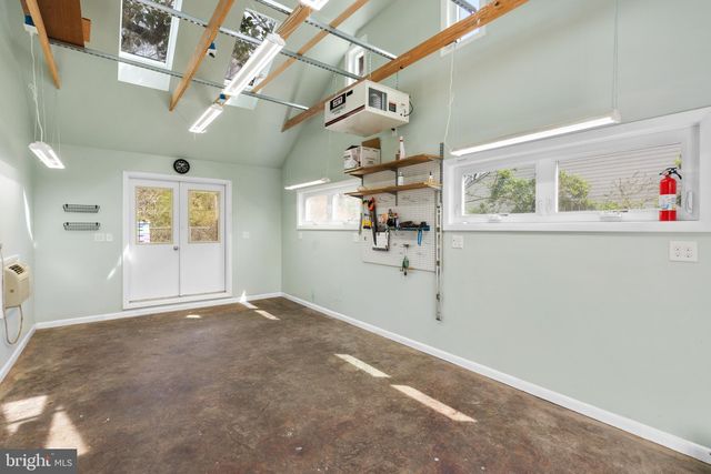 front view of a brick house with a small yard