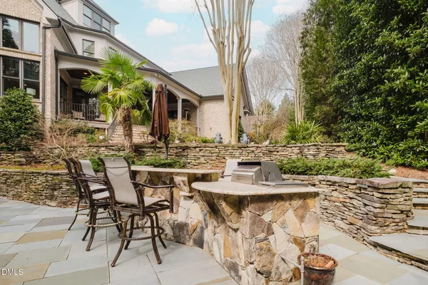 a view of an chairs and table in the patio