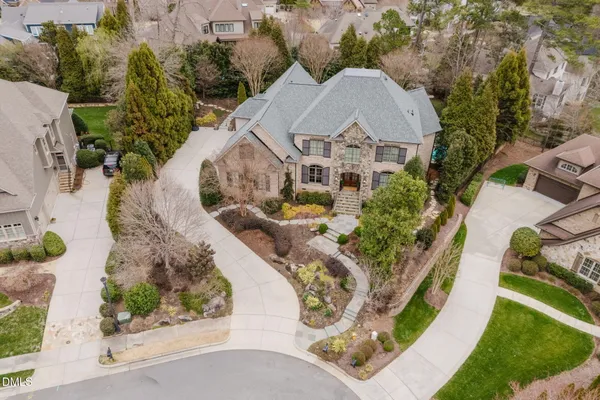 an aerial view of a house with outdoor space