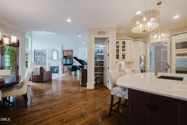 a view of a dining room with furniture large windows and wooden floor