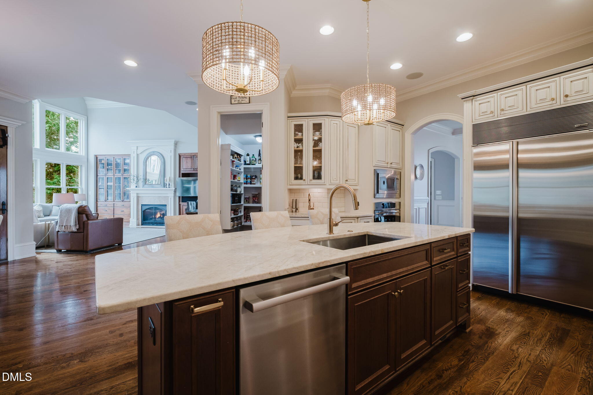 3604 Nightfall Court Raleigh, NC 27607 - Photo 25 of 79 a kitchen with granite countertop a sink stainless steel appliances and wooden floor