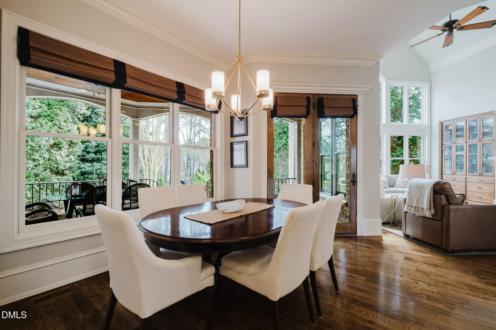 3604 Nightfall Court Raleigh, NC 27607 - Photo 29 of 79 a view of a dining room with furniture large windows and wooden floor