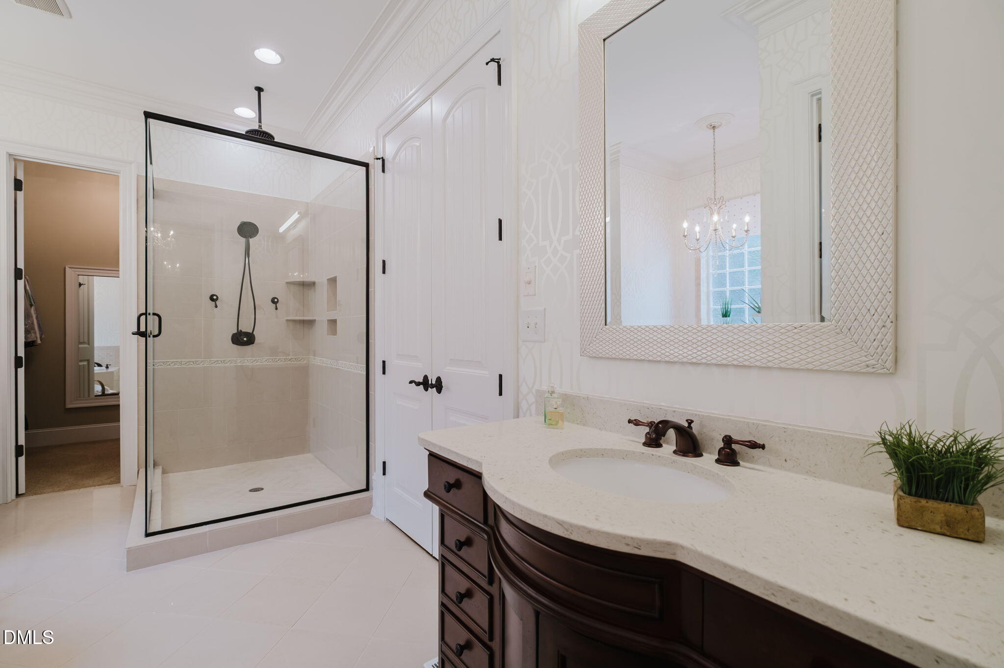 3604 Nightfall Court Raleigh, NC 27607 - Photo 37 of 79 a bathroom with a shower sink and mirror